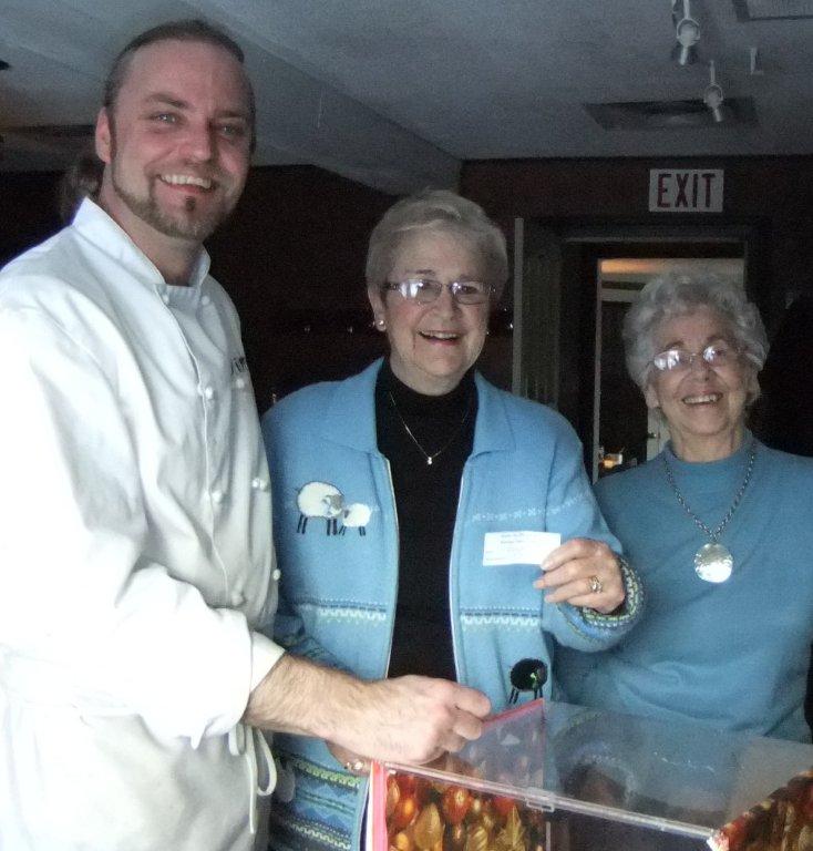 L-R Andreas Feller, owner of Blumen Garden Bistro presents the proceeds of $213.95 from the 2010 Community Care Christmas Memory Tree to Maureen Finnegan and Edith Morash