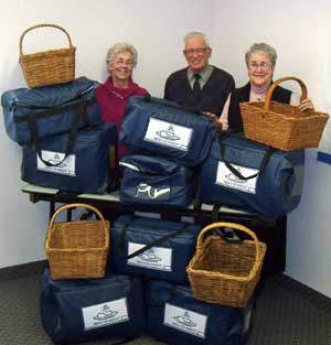 Meals on Wheels volunteers (L-R) Edith Morash, Stan Whitehouse and Maureen Finnega n with the new delivery containers. 