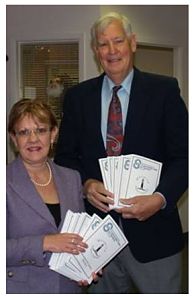 Wendy Davis, President of Hospice Prince Edward and Ken Noble, chair of the board of Prince Edward Community Care with the new Information for Seniors Directory that is available free to seniors in The County.